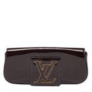 Pre-owned Leather clutches Louis Vuitton Vintage , Red , Dames