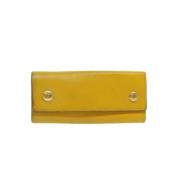 Pre-owned Leather key-holders Hermès Vintage , Yellow , Dames