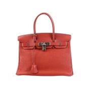 Pre-owned Leather handbags Hermès Vintage , Red , Dames