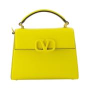 Grained leather handbag with adjustable strap Valentino Garavani , Yel...