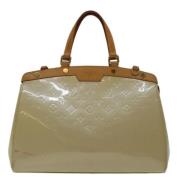 Pre-owned Leather handbags Louis Vuitton Vintage , Beige , Dames