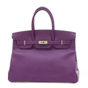 Pre-owned Leather handbags Hermès Vintage , Purple , Dames