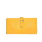 Pre-owned Leather wallets Hermès Vintage , Yellow , Dames