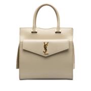 Pre-owned Leather handbags Yves Saint Laurent Vintage , Beige , Dames