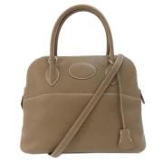 Pre-owned Leather handbags Hermès Vintage , Beige , Dames