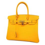 Pre-owned Fabric handbags Hermès Vintage , Yellow , Dames