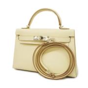 Pre-owned Fabric handbags Hermès Vintage , Beige , Dames