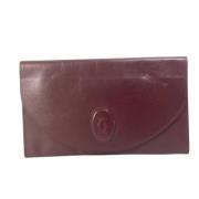 Pre-owned Leather clutches Cartier Vintage , Red , Dames