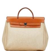 Pre-owned Canvas hermes-bags Hermès Vintage , Orange , Dames