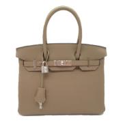 Pre-owned Leather handbags Hermès Vintage , Beige , Dames