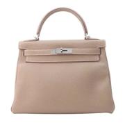 Pre-owned Leather handbags Hermès Vintage , Beige , Dames