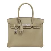 Pre-owned Leather handbags Hermès Vintage , Beige , Dames