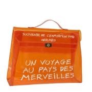 Pre-owned Vinyl handbags Hermès Vintage , Orange , Dames