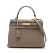 Pre-owned Canvas handbags Hermès Vintage , Brown , Dames