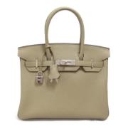 Pre-owned Leather handbags Hermès Vintage , Beige , Dames