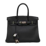 Pre-owned Leather handbags Hermès Vintage , Black , Dames