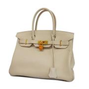 Pre-owned Leather handbags Hermès Vintage , Beige , Dames