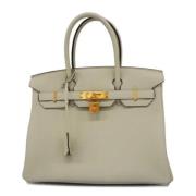 Pre-owned Leather handbags Hermès Vintage , Beige , Dames