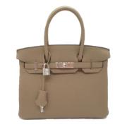 Pre-owned Leather handbags Hermès Vintage , Beige , Dames