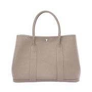 Pre-owned Leather handbags Hermès Vintage , Beige , Dames