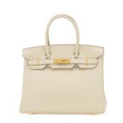 Pre-owned Leather handbags Hermès Vintage , Beige , Dames