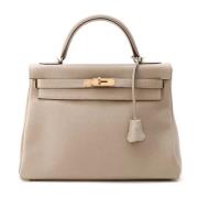 Pre-owned Leather handbags Hermès Vintage , Beige , Dames