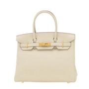 Pre-owned Leather handbags Hermès Vintage , Beige , Dames