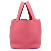 Pre-owned Leather handbags Hermès Vintage , Pink , Dames