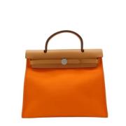 Pre-owned Canvas handbags Hermès Vintage , Orange , Dames