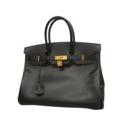 Pre-owned Leather handbags Hermès Vintage , Black , Dames