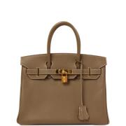 Pre-owned Canvas handbags Hermès Vintage , Brown , Dames