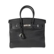 Pre-owned Leather handbags Hermès Vintage , Black , Dames