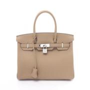 Pre-owned Leather handbags Hermès Vintage , Beige , Dames