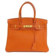 Pre-owned Leather handbags Hermès Vintage , Orange , Dames