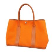 Pre-owned Canvas handbags Hermès Vintage , Orange , Dames