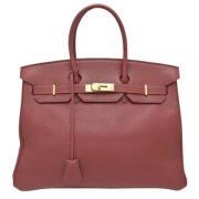 Pre-owned Leather handbags Hermès Vintage , Red , Dames