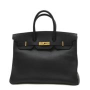 Pre-owned Leather handbags Hermès Vintage , Black , Dames