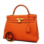 Pre-owned Leather handbags Hermès Vintage , Orange , Dames