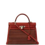 Pre-owned Canvas handbags Hermès Vintage , Red , Dames