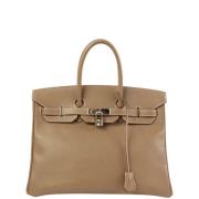 Pre-owned Canvas handbags Hermès Vintage , Brown , Dames