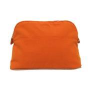 Pre-owned Cotton clutches Hermès Vintage , Orange , Dames