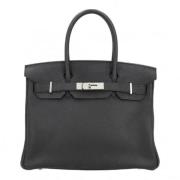 Pre-owned Leather handbags Hermès Vintage , Black , Dames