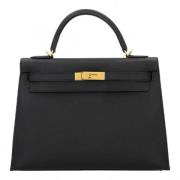 Pre-owned Leather handbags Hermès Vintage , Black , Dames