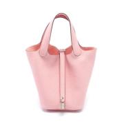 Pre-owned Leather handbags Hermès Vintage , Pink , Dames