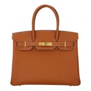 Pre-owned Leather handbags Hermès Vintage , Brown , Dames