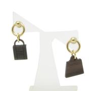 Pre-owned Metal earrings Hermès Vintage , Yellow , Dames