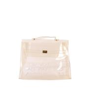 Pre-owned Vinyl handbags Hermès Vintage , Beige , Dames