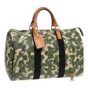 Pre-owned Canvas handbags Louis Vuitton Vintage , Green , Dames