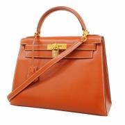 Pre-owned Leather handbags Hermès Vintage , Orange , Dames