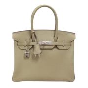 Pre-owned Leather handbags Hermès Vintage , Beige , Dames